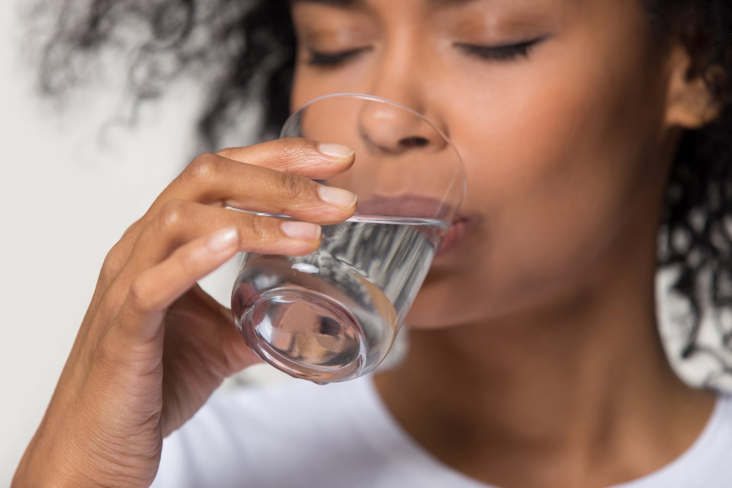 woman drinking water for hydration
