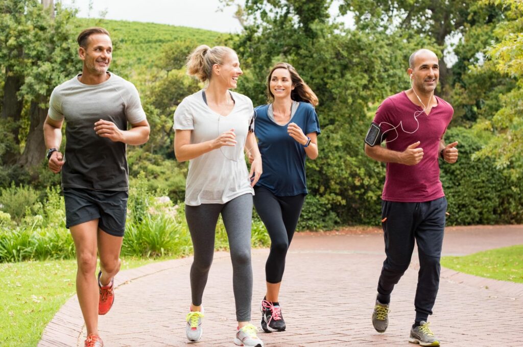 group of people jogging for regular exercise
