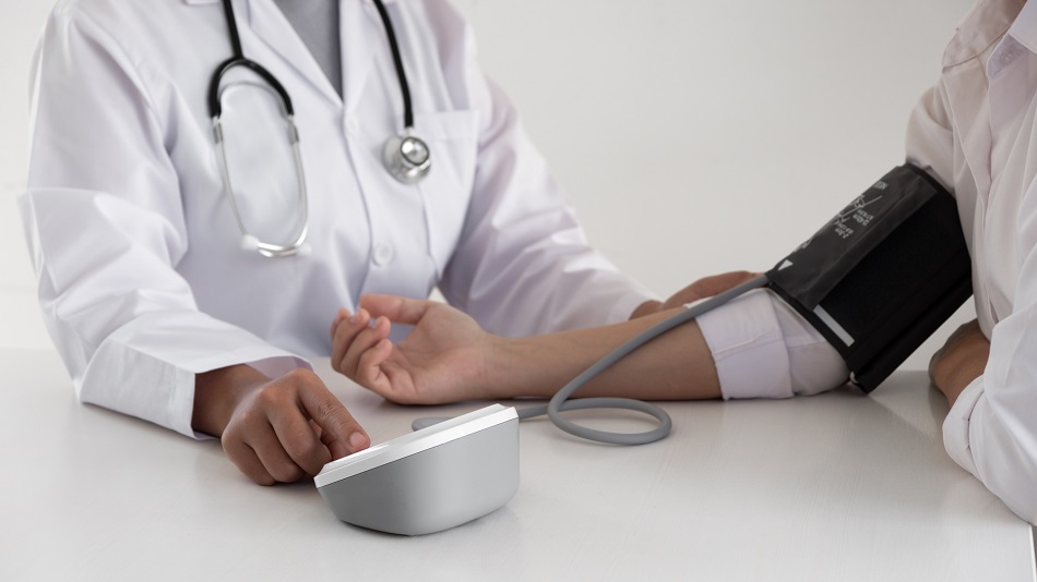 doctor performing blood pressure test