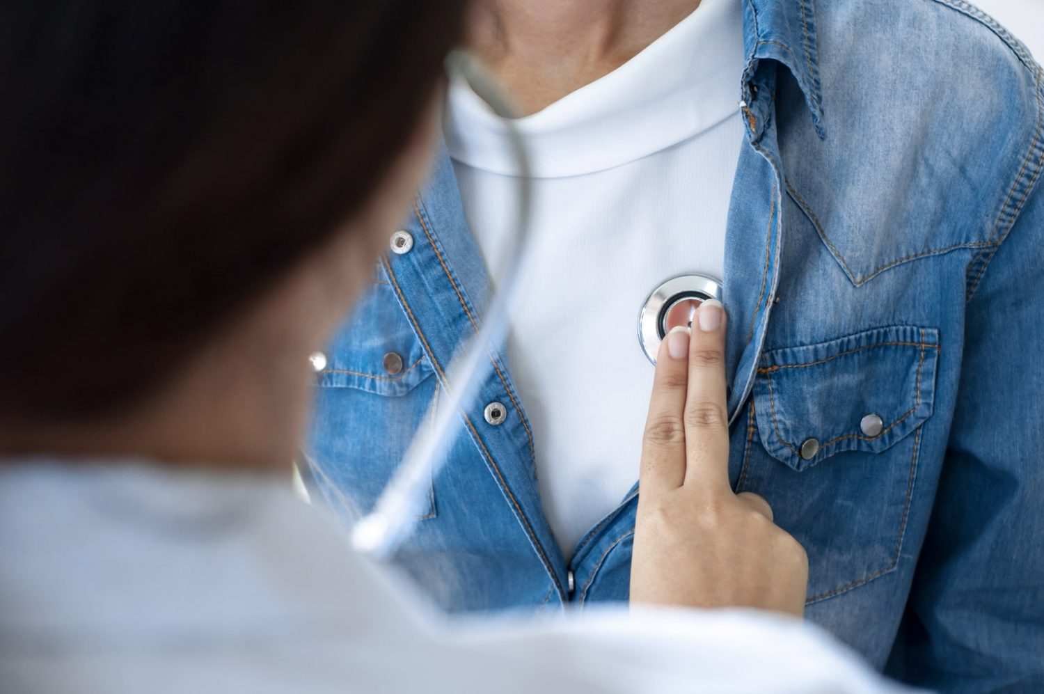 Physician listening to patient's heart